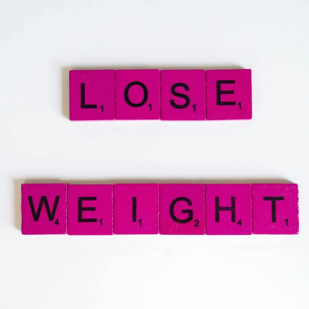 Text blocks spelling out 'Lose Weight' on a white background, representing the title 'How to Use Topiramate for Weight Loss | A Beginner's Guide.