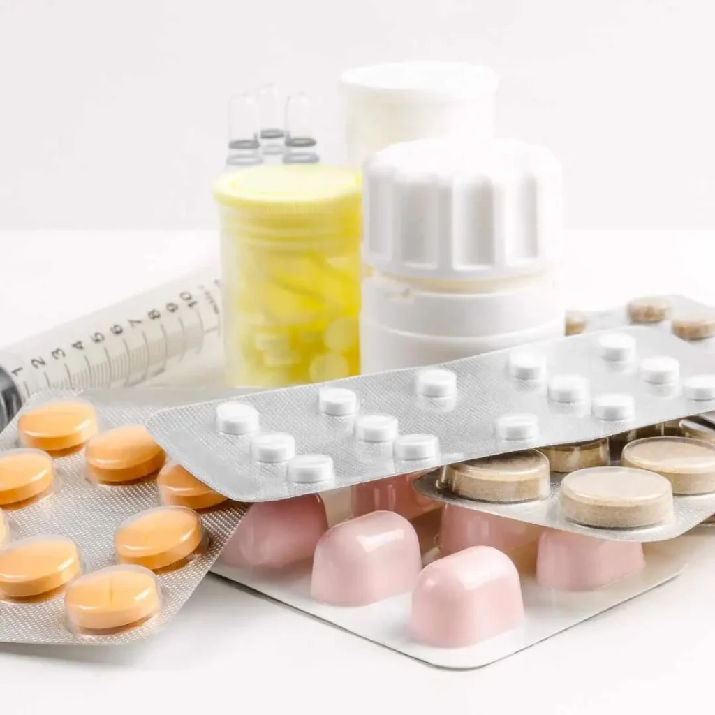 A variety of medical supplement bottles and blister packs filled with different types of pills, representing various potassium supplements available in the market.